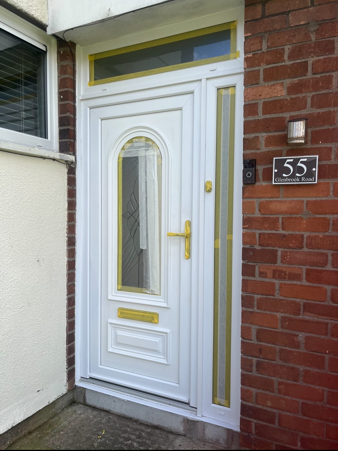 PVC front door taped up before being sprayed