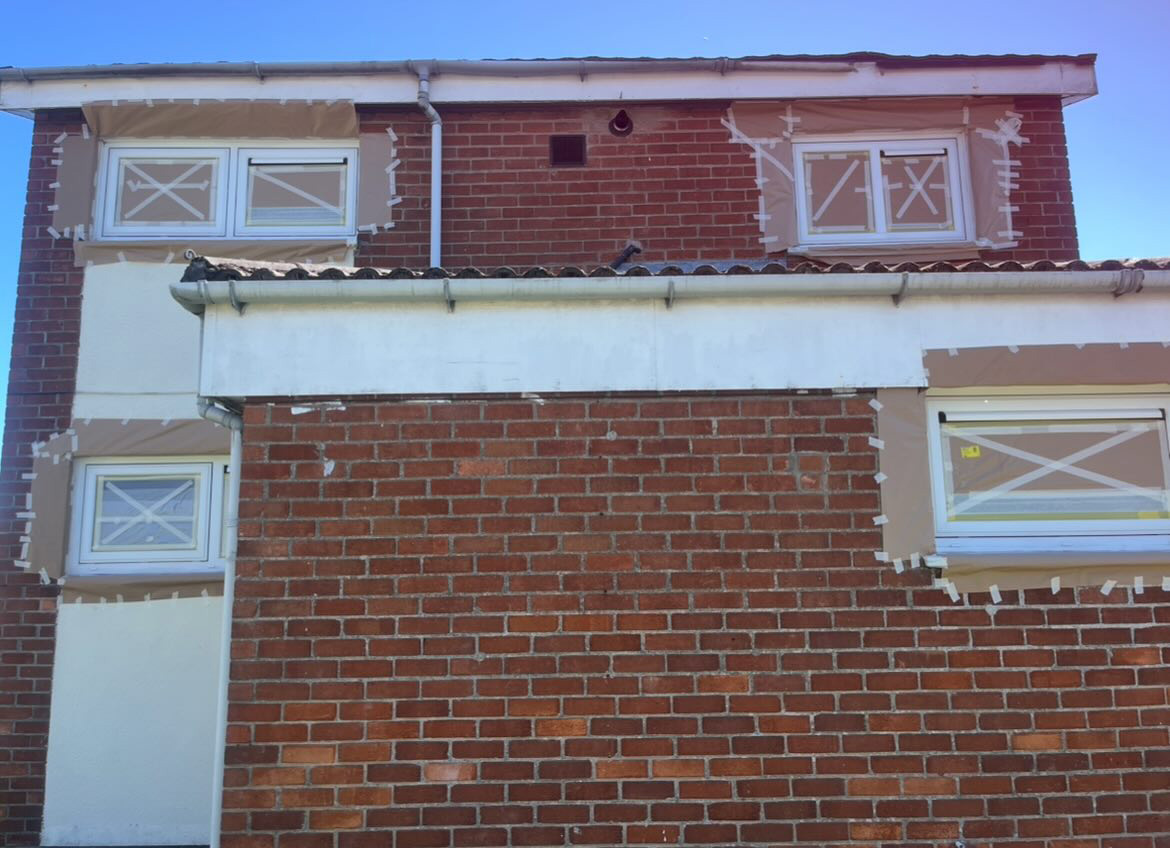 Windows taped and masked for respraying in Newtownards